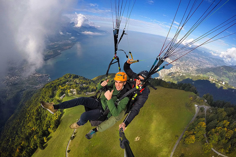 A youth and an adult paragliding